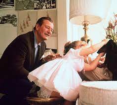 John Wayne at home with his wife Pilar Wayne and their daughter Aissa in  Encino, California, 1958. Photos by Bernie Abramson JohnWayne