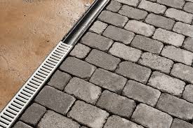 The drains have holes on the side that will accept large galvanized spikes, which would hold it in place. 5 Potential Benefits Of Installing A Channel Drain Engineering Feed