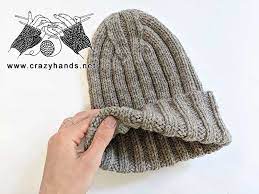 One cool thing about this pattern is that the ribbing doesn't swirl at the crown, it is eaten up in more of a star shape (you'll find a photo towards the end of the post). Knit Ribbed Beanie With Catchy Crown Crazy Hands