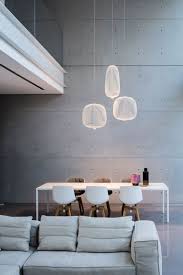 Lighting Design Idea 8 Different Style Ideas For Lighting Above Your Dining Table Hang Three Penda Minimalism Interior Interior Lighting Concrete Interiors