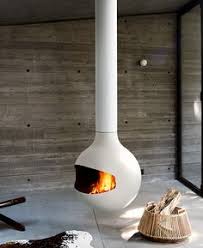 For a cozy feel without the heat, choose from the indoor fireplaces that display a flickering flame without heat. 30 Suspended Fireplaces Ideas Suspended Fireplace Modern Fireplace Hanging Fireplace