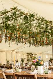 Dress up your wedding chairs with a floral garland. Hanging Floral Display Within Our Traditional Tent By Mathew Oliver Http Www Matthewoliver Co Uk Marquee Decoration Romantic Garden Wedding Marquee Wedding