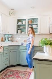 I couldn't leave this solid oak cabinet by the dumpster. Before After A Bright Affordable Diy Kitchen Update Holland Avenue Home Updated Kitchen Turquoise Cabinets Diy Kitchen