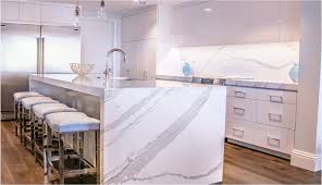 White quartz full height backsplash. Transitional Two Tone Kitchen