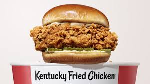 Kentucky fried chicken (traducible al español como pollo frito de kentucky), conocida oficialmente por sus siglas kfc, es una cadena de restaurantes de comida rápida estadounidense especializada en pollo frito, fundada por harland d. Kfc Introduces Its Best Chicken Sandwich Ever Markets Insider