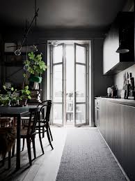Go for broke with dark furniture and rugs, which take up a lot of visual real estate in your room and will help bring the moody vibe. Black Is The New Black 8 Deliciously Dark Kitchens Apartment Therapy