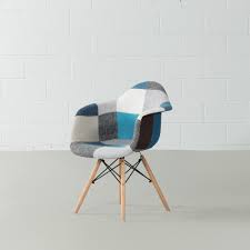 By buying on this website you can save £100's by buying direct from us the manufacturer rather than a retail store or website. Eames Style Blue Monochrome Patchwork Armchair Wazo Furniture
