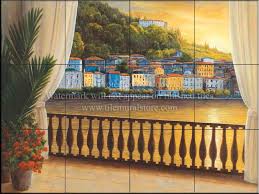 Beautiful italian tile backsplash mural of a kitchen window featuring a still life of olive tiles, grapes, bread, cheese, garlic, olive oil, olives, rosemary, lemons and a hummingbird by american artist linda paul. Decorative Tile With Waterviews Italian View Tile Mural