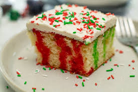 Soft cake layers, creamy vanilla frosting, and lots of sprinkles make it a welcome addition to your holiday parties! Christmas Poke Cake Moore Or Less Cooking