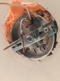 If it's screwed to a hanger when the wires are set up, hide them inside the electrical box and press the chandelier's canopy. Will This Box Hold A 35 Pound Light Fixture Home Improvement Stack Exchange