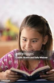 Surprised Girl Reading A Book High-Res Stock Photo