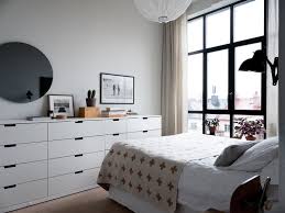 Monochrome colour palette for this compact entrance. A Scandinavian Apartment With Floor To Ceiling Windows The Nordroom Guest Bedroom Design Bedroom Design Ikea Bedroom
