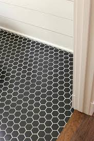 Black And White Bathroom Tiles Floor A Black Hexagon Tile Floor With White Grout And Shiplap Walls Bathroomtiles Black Floor Tiles Black Hexagon Tile White Hexagon Tile Bathroom