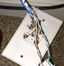 Punching down cat 5e wires onto the ethernet jack. Convert Single Cat 5e Into Ethernet And Phone Kristianreese Com