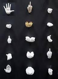Amazon Com Interior Illusions Ceramic Female Talk To The Hand Wall Hook Home Kitchen Wall Hooks Hand Sculpture Crafts