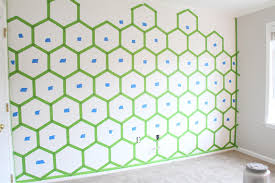 On the wall where you want to paint the hexagon design, use a level and straightedge to draw parallel vertical lines 10 inches apart with a fine pencil. Honeycomb Ombre Hexagon Accent Wall Grosgrain