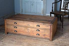 Saltoro sherpi wooden coffee table with bottom shelf and metal legs, brown and black. Map Drawer Coffee Table Iron Accents