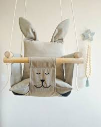 The coziest detail in this modern apartment designed by svoya studio is the plush, braided hammock placed by the foyer. Babyschaukel Bunny Baby Swing Swing Kids Childrens Schaukel Etsy Baby Hammock Kids Hammock Kids Swing