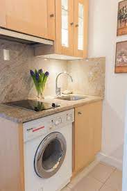 Two Burner Stove Top And Washing Machine In The Kitchen Washing Machine In Kitchen Apartment Washing Machine Simple Kitchen Design