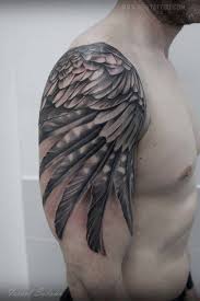 Black And Grey Wing Tattoo On The Right Upper Arm And Shoulder Wing Tattoo Men Wings Tattoo Wing Tattoo On Shoulder