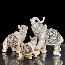 I glazed this sturdy mug in a variegated teal glaze, leaving the silhouette of an equally sturdy elephant on the bare stoneware clay. Creative Lucky Elephant Statue Elephant Figurines Resin Office Miniatures Golden Feng Shui Elephant Ornament Home Decoration Figurines Miniatures Aliexpress