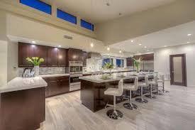The breakfast bar is located in long beach city of california state. Contemporary Kitchen With Oak Laminate Flooring And Long Breakfast Bar Island Contemporary Kitchen Gorgeous Kitchens Contemporary Kitchen Design