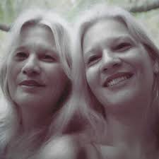 Request to edit photo of twin sisters with makeup and shirt color change