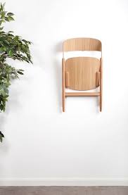 The Folding Chair Gets A Modern Update Wooden Folding Chairs Wood Folding Chair Folding Chair