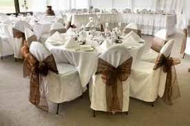Close up of tan leather sofa with linen cushions. Lovely Wedding Chairs Chair Covers Wedding Wedding Reception Seating