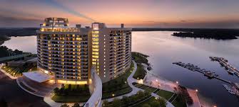 The main area floor plan includes a living room with fireplace, flat screen tv, dining. Bay Lake Tower Dvc Rental Store