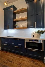 Blue Cabinets With Open Walnut Shelves And Gold Accents In Hardware And Lighting In 2020 Blue Cabinets White Marble Countertops Kitchen