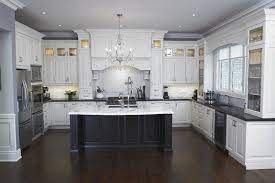 The only downside to black for your countertops is the fact that just like a car, black tends to show everything. 15 Affordable Black And White Kitchen Cabinets Lmolnar Kitchen Remodel Small Kitchen Remodel Countertops Kitchen Layout