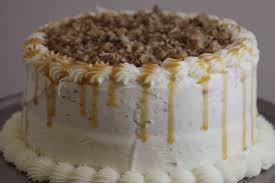 White Chocolate Praline Cake Moist White Chocolate Cake Covered With White Chocolate Frosting And Topped With Ca Bakery Praline Cake White Chocolate Frosting