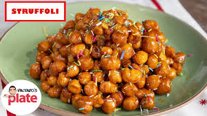 Using a large spoon or damp hands, arrange the struffoli and hazelnuts around the glass to form a wreath shape. How To Make Struffoli Honey Balls Struffoli Recipe Youtube