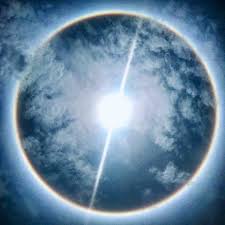 Halo (from greek ἅλως, halōs) is the name for a family of optical phenomena produced by light (typically from the sun or moon) interacting with ice crystals suspended in the atmosphere. Sun Halo Dazzles In Sky Over Costa Rica