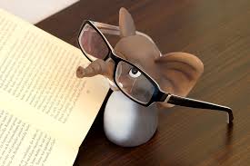 Cartoon image of mouse wearing glasses looking at a book. Also a link to information about books and e-books in the library