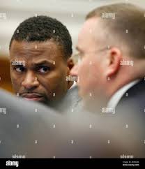 Attorney Fernando Mack, left, looks at attorney Derek Lowry, during the  testimony of Richard Mitchell in the trial of former Canton patrolman Bobby  Cutts Jr., in the death of Jessie Marie Davis,