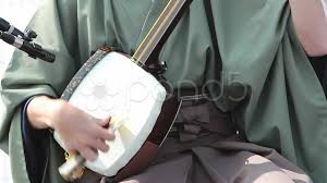 It is played with a plectrum called a bachi. Traditional Japanese Stringed Instrument Stock Video Pond5