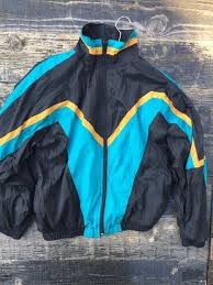 The official colors of the jacksonville jaguars football team are teal, black, and gold. Jacksonville Jaguars W Color Block Windbreaker Boardwalk Vintage