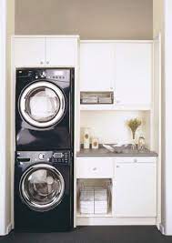 I removed all the old wire shelving and hardware, filled the holes with putty, sanded and repainted the space. 11 Stacked Washer Dryer Ideas Laundry Room Laundry Room Storage Laundry Mud Room