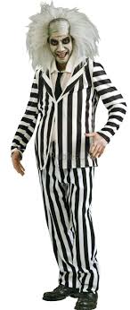 This beetlejuice halloween costume from party city includes a black and white striped jacket and pants with a white dickie and an attached tie. Beetlejuice Costume