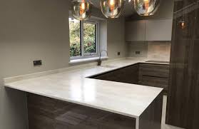 With a blend of hickory cabinets and colorful southwestern décor, this spacious kitchen remodel has a warm, earthy atmosphere. Corian Worktops Solid Surfaces Uk Worktops Direct