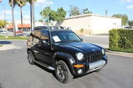 Image result for Brilliant Black 2003 Jeep