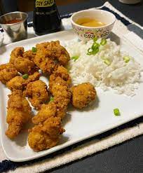 Take the chicken nuggets and coat with flour, dip in egg and cover with the panko/oregano mix. Spicy Chicken Nuggets And Rice With Copycat Cfa Sauce Dining And Cooking