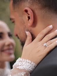 Congratulations to our beautiful couple, Lara & Dani @lara.shaya ,  @danizeid Lara is wearing a masterpiece of haute couture, featuring  intricate hand-made embroidery that adorns the delicate fabric. The gown's  silhouette is