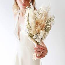 While cooks appreciate the distinctive taste and scent of sage, gardeners also enjoy its velvety, evergreen foliage, and delicate blooms. Green And White Dried Flower Wedding Bouquet Lisa Angel