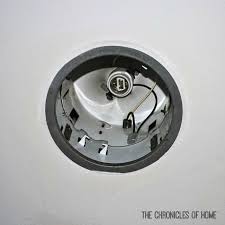 Squeeze the side spring clips to remove the light housing; Tutorial How To Convert Recessed Lights To Pendants The Chronicles Of Home