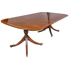 In the late 1950s, baker introduced the milling road label to reach a younger audience with stylish but less costly furnishings like console tables, walnut dining chairs and more, and in 1961, british furniture designer t.h. Georgian Style Mahogany Banded Dining Table By Baker With Two Leaves At 1stdibs