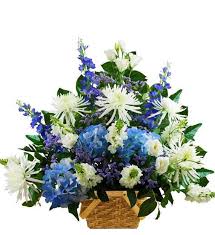 Combined with lush foliage, this traditional funeral flower arrangement is a soft and pretty design in tones of dusty pink, purple and white. Traditional Blue And White Sympathy Basket Avas Flowers