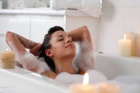 Three women in bath towels posing in studio, beauty portrait. How To Set Up Your Bath For The Perfect Me Time